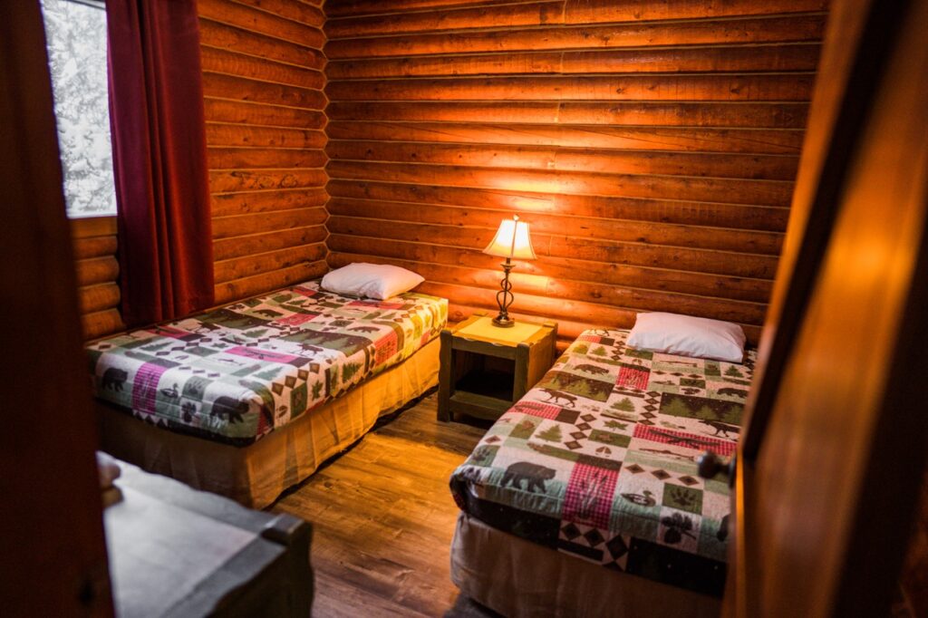 Comfortable cabin bedroom setup designed for long-term stays for construction crews.