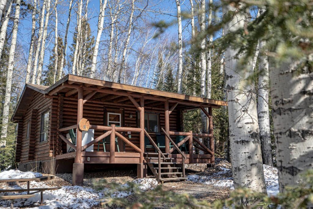 Exterior view of a private log cabin at Bakers Narrows Lodge, ideal for construction crew lodging near Flin Flon.