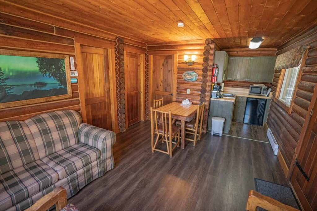 Cozy cabin living room interior at Bakers Narrows Lodge, offering affordable extended stay accommodations near Flin Flon for crews.