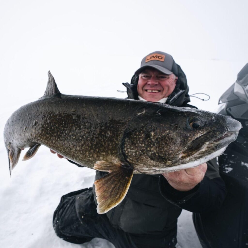 An angler holding a trophy fish at Lamuchawie Lake