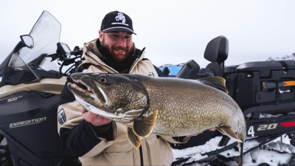 Frank Ragnow holding a trophy trout he caught at Kamuchawie Lake