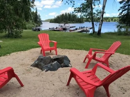 Lakeside seating area with firepit—relaxation at Manitoba Fishing Lodge