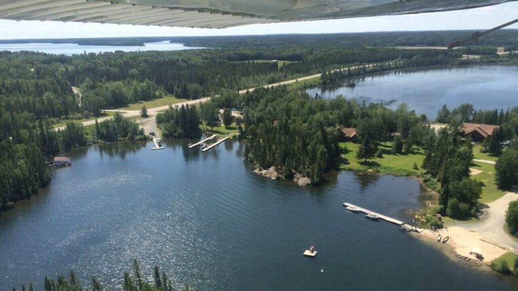 Aerial view of a Manitoba fishing lodge surrounded by lakes and forest.