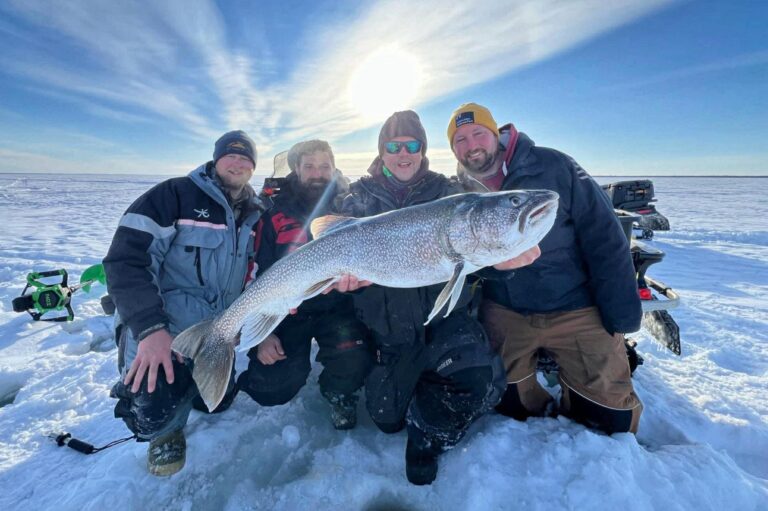 group of friends ice fishing in Manitoba