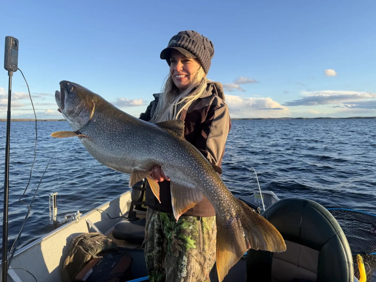 Nicole Stone holding a trophy lake trout at the Kamuchawie Lake fly-in outpost, Bakers Narrows Lodge