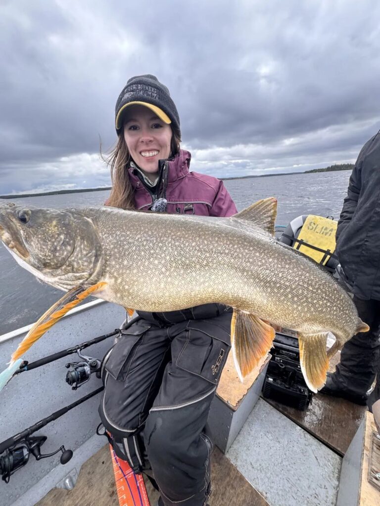 Angler with a big lake trout at the Kamuchawie Lake fly-in outpost