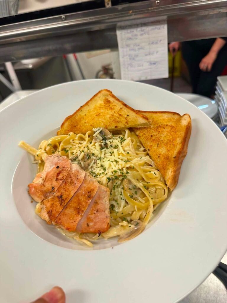 Grilled chicken fettuccine alfredo with mushrooms and garlic toast from Bakers Narrows Lodge