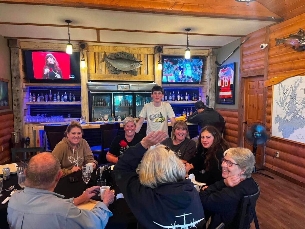 Group of guests enjoying dinner together at the Bakers Narrows Lodge Club House
