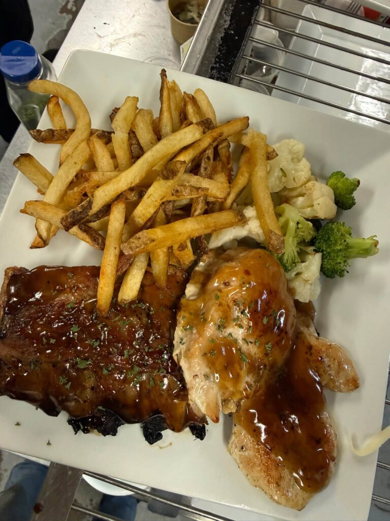 Bakers Ribs and grilled chicken with fresh-cut fries at The Club House restaurant in Flin Flon