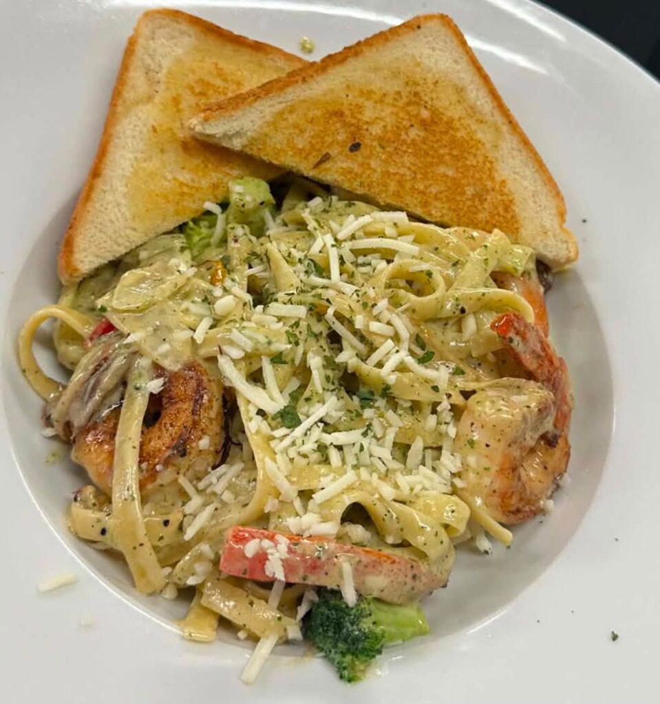 Creamy shrimp fettuccine with garlic toast at The Club House in Flin Flon